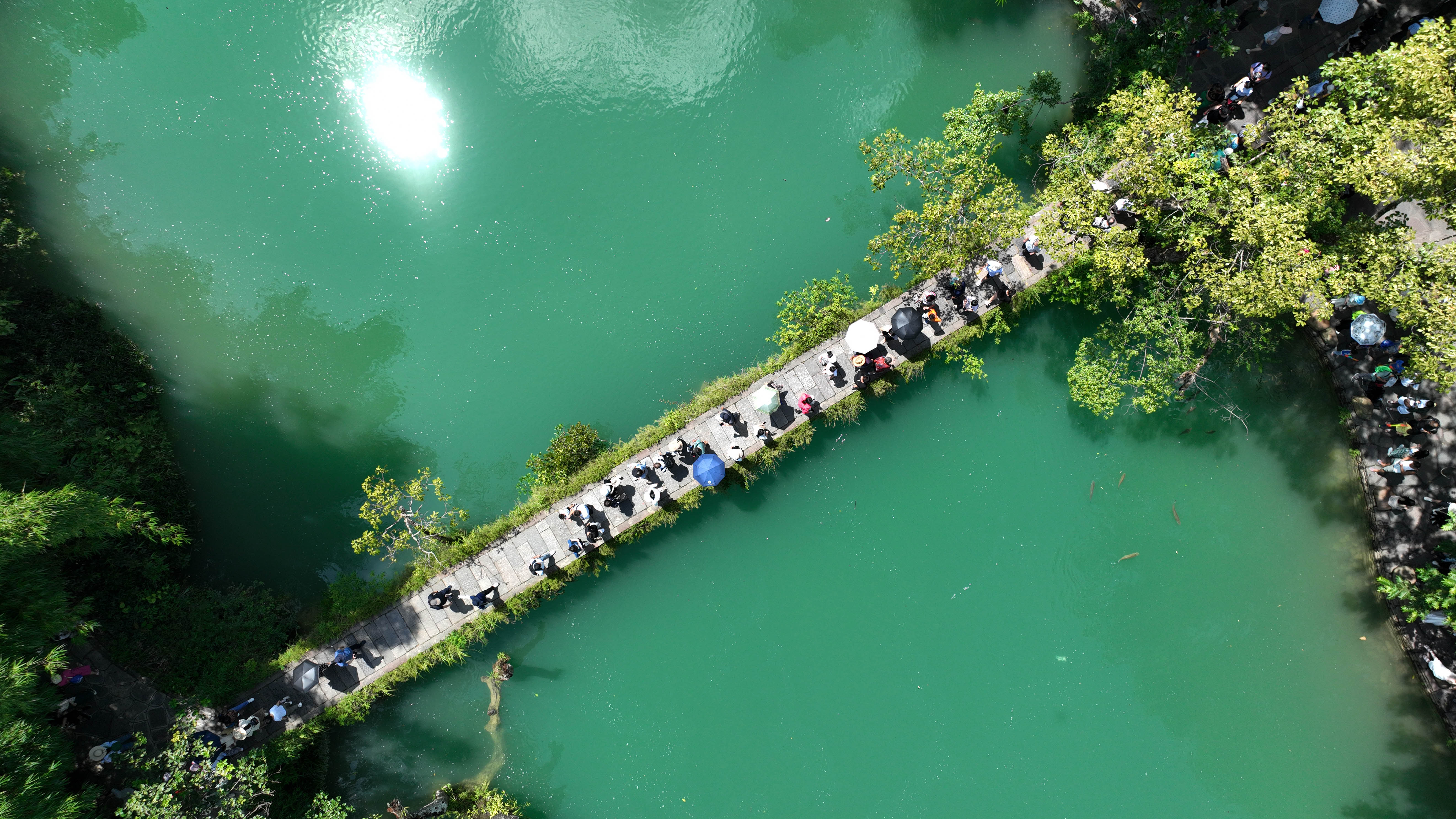 Visitors in Libo county’s Xiaoqikong Scenic Area in Guizhou Province.