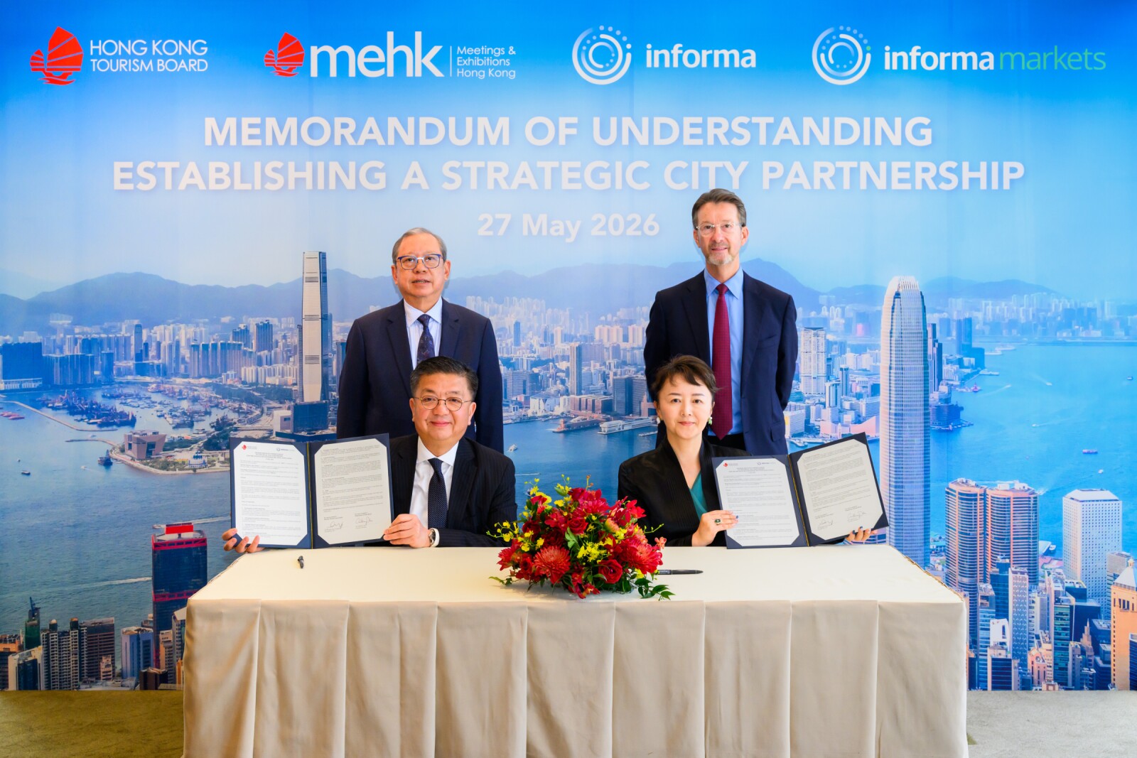 The Hong Kong Tourism Board and Informa Markets held a signing ceremony in Hong Kong today. The ceremony was witnessed by Dr. Peter Lam, HKTB Chairman (back left), and Mr. Stephen Carter, Group CEO, Informa Group (back right). Mr. Anthony Lau, HKTB Executive Director (front left), and Ms. Margaret Ma Connolly, President & CEO of Informa Markets Asia (front right), signed the Memorandum of Understanding on behalf. HKTB