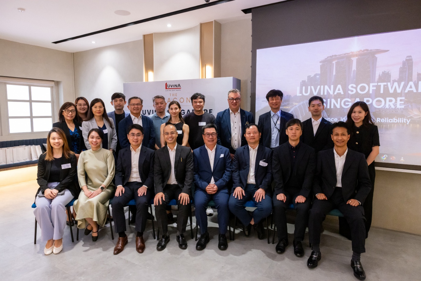 Management, partners, and guests commemorate the official launch of Luvina Software Singapore. (Front row, second from left: Lynn Le, Director of Luvina Singapore; Ethan Lim, CEO of Luvina Software Singapore; and Le Quang Luong, Co-Founder and CEO of Luvina Software).