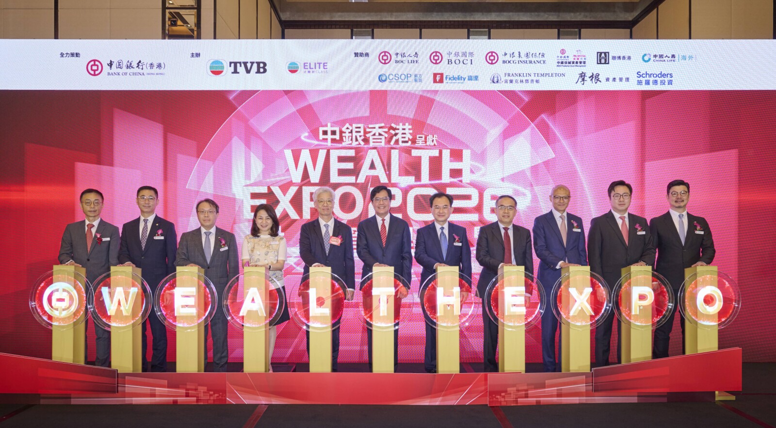 Officiating guests - Mr. Michael WONG, GBS, JP, Acting Financial Secretary of the HKSAR Government (6th left); Mr. Christopher HUI, GBS, JP, Secretary for Financial Services and the Treasury of the HKSAR Government (4th right); and Mr. Stephen CHAN, Deputy Chief Executive of BOCHK (5th right); together with other attending guests, including Mr. SIU Sai Wo, General Manager (Business Operations) of TVB (5th left); and representatives from BOCHK.
