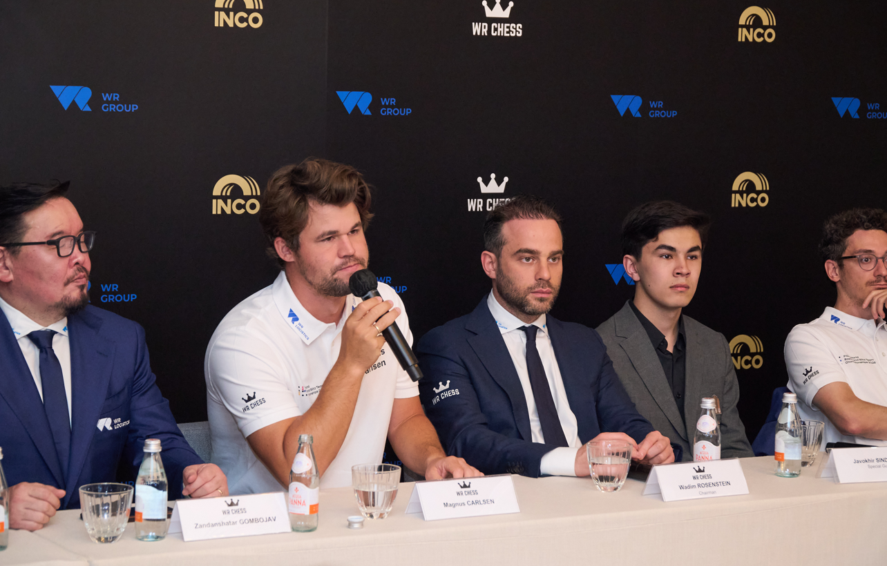 Magnus Carlsen (Left 2), five-time World Champion, answers questions from reporters at the WR Chess press conference in Hong Kong, 16 June 2026.