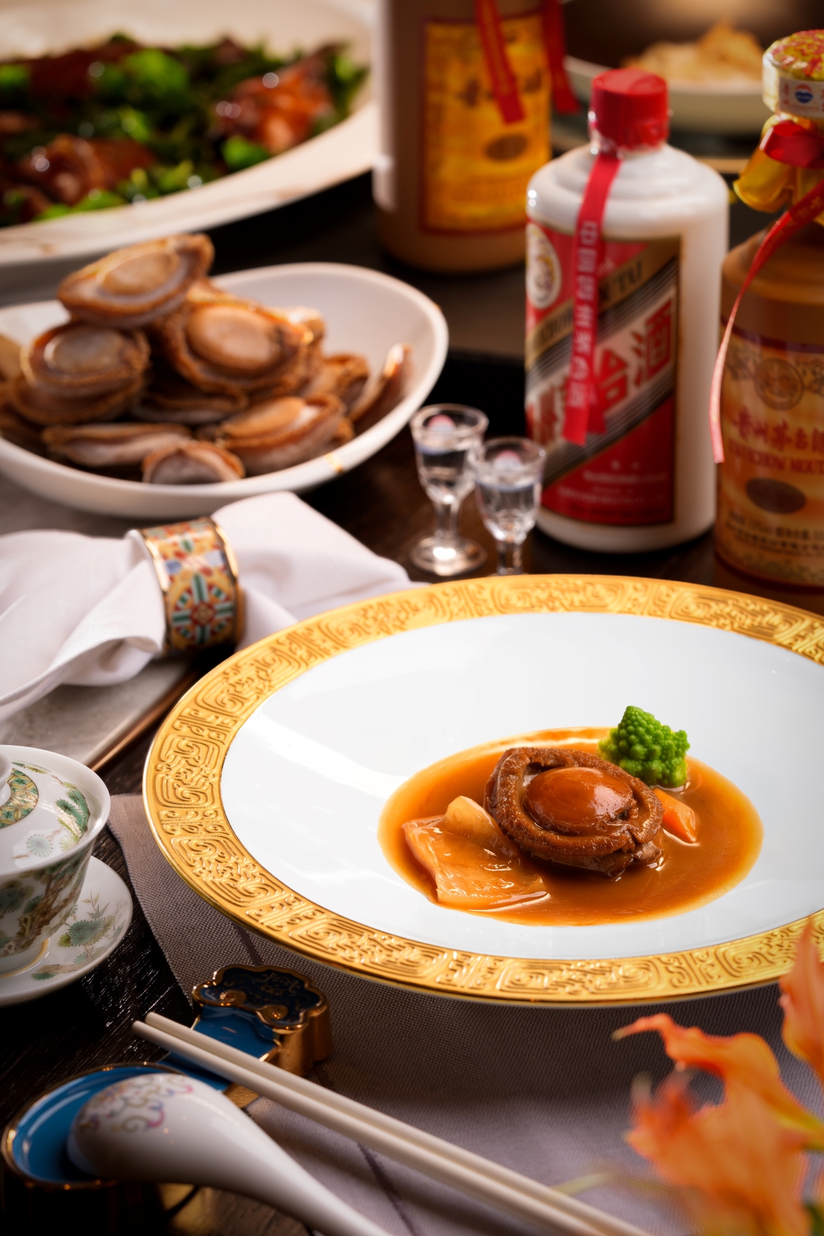 Roasted Goose with Fermented Black Bean and Mint alongside House of Origin Abalone infused with Moutai aromas, thoughtfully paired with rare aged Moutai, celebrating the timeless artistry and elegance of Cantonese gastronomy at