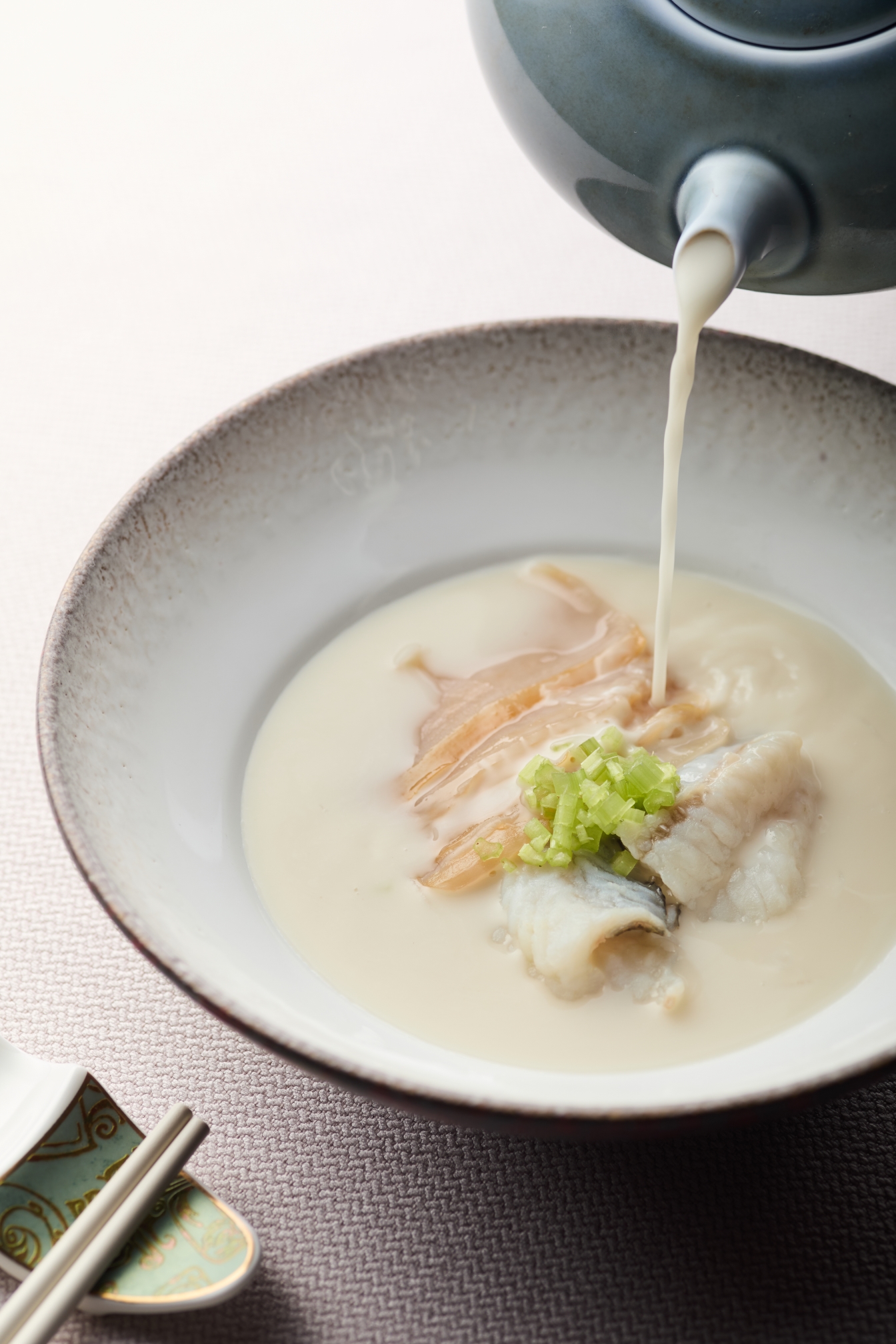 A four-hour boiled white pepper broth with geoduck, wild sole and rice noodles, offering comforting flavours and finished tableside.