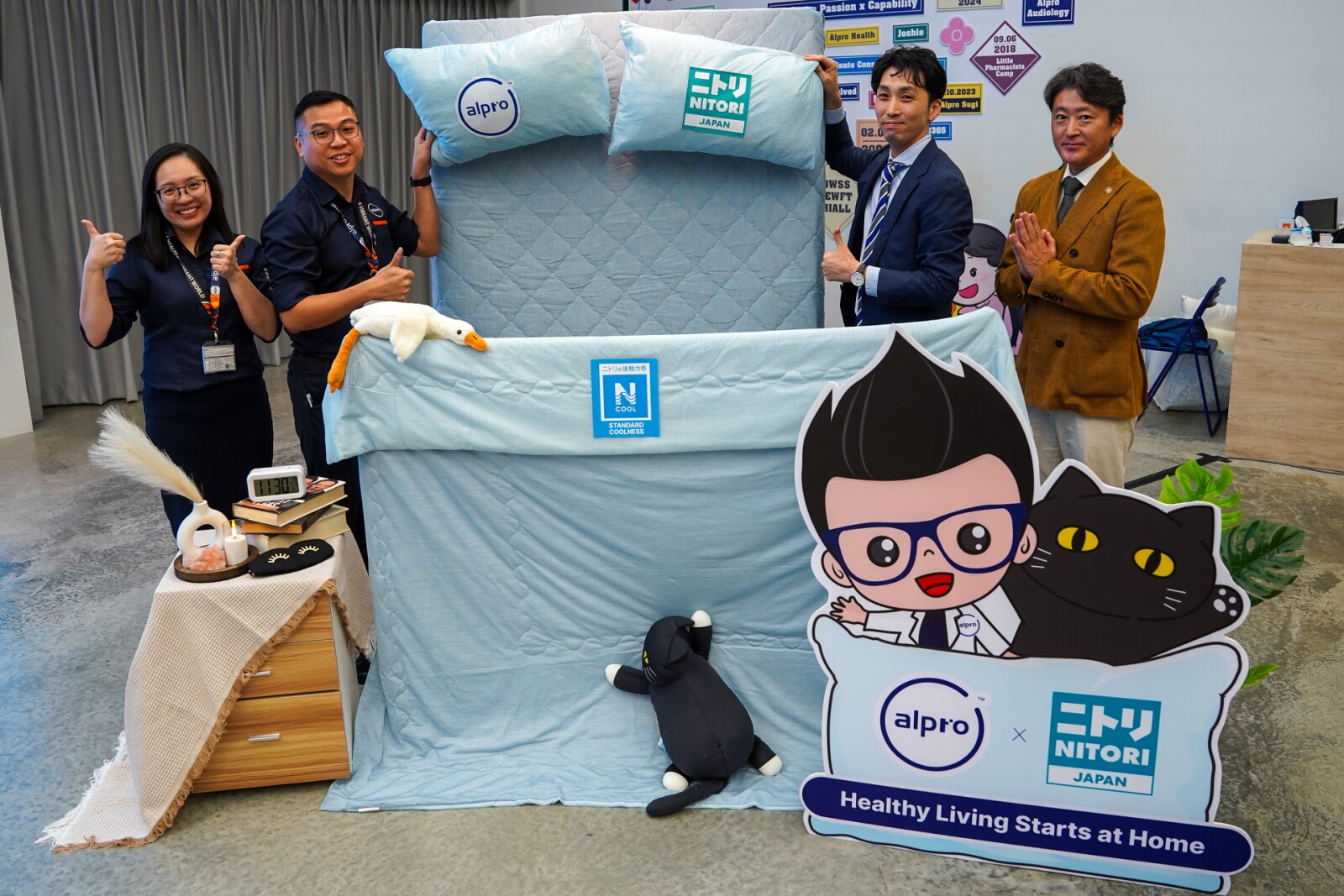 Representatives from Alpro Group and NITORI Malaysia participate in the symbolic launching gimmick, highlighting the shared commitment to promoting better sleep and healthier living. From left to right: Ph. Lim En Ni (Chief Pharmacist & Customer Engagement Director of Alpro Group), Ph. Wong Wen Jun (Procurement Director of Alpro Group), Mr. Maezawa Yuta (Country Store Manager of NITORI Malaysia), Mr. Wada Tsutomu (ASEAN Marketing & E-Commerce Manager)